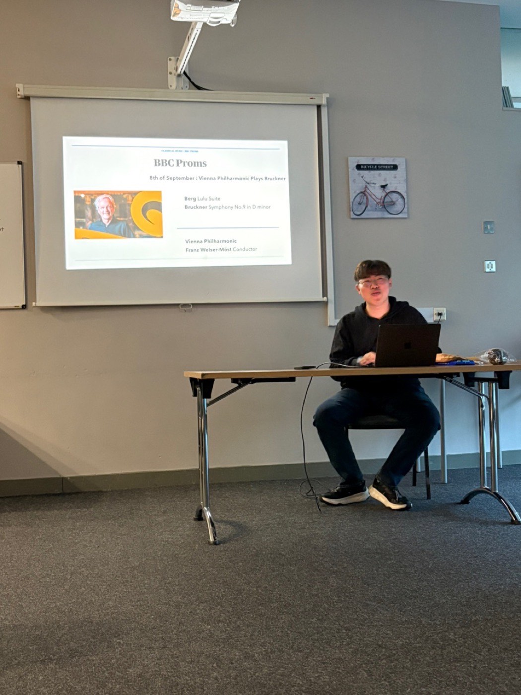 Our founder giving a talk, with a slide about the BBC Proms on the screen